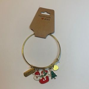 Handmade gold tone stainless steel bracelet with 5 charms.